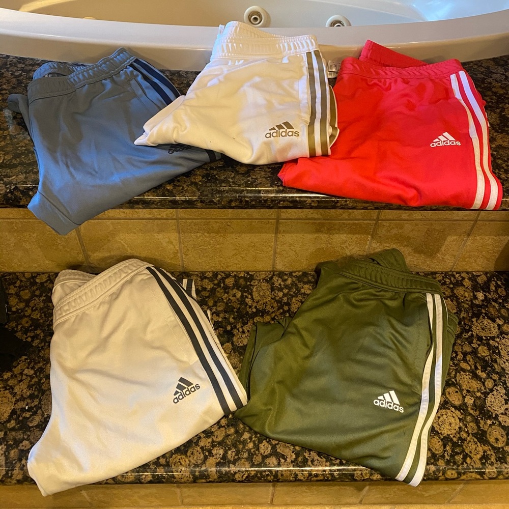 Adidas Track pants with zippered ankles.